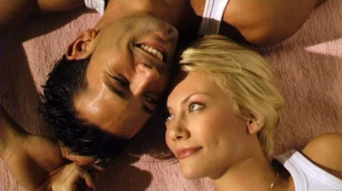 Young couple lying on floor Stock Footage 43699464