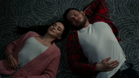 Young Couple Is Lying On Floor Stock Footage 145486008