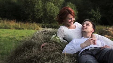 Young couple lying on a haystack 動画素材 55159819