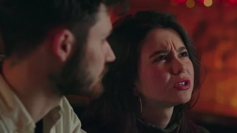 Young couple make an order at the bar. Boyfriend with girlfriend choosing Stock Footage 253629328