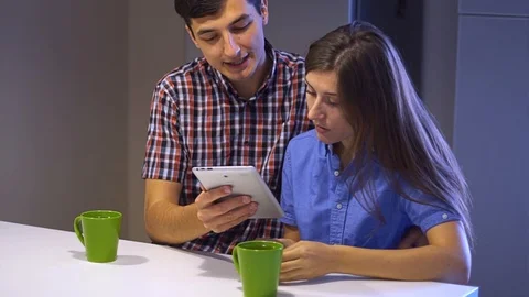 Young couple make shopping purchasing online using tablet and phone Stock Footage 100266872