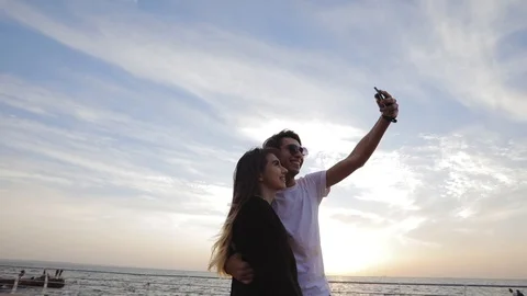 Young couple makes selfie Stock Footage 99864232