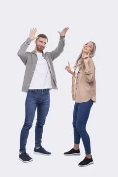 Young Couple Making High Five Standing Isolated. Sign Stock Photos