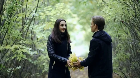 Young Couple Man and Woman Hugging in Love Romantic Outdoor with forest nature o Stock Footage