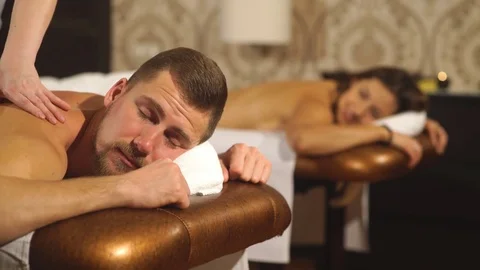 Young couple massage,man doing a back massage Stock Footage 70517634