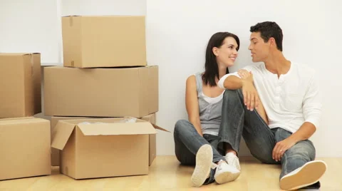 Young Couple with Moving Boxes Stock Footage 912332