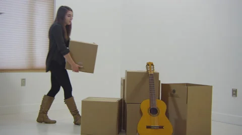 Young couple moving boxes Stock Footage 67363618
