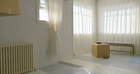 Young couple moving boxes out of their new home. Stock-Footage 88373706