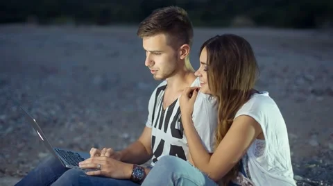 Young Couple at a Notebook Stock Footage 67462430