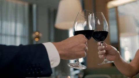 A young couple over a romantic dinner clink glasses Stock Footage 102665109
