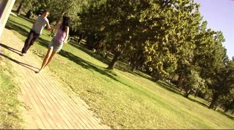 Young couple in park running Stock Footage 43683720