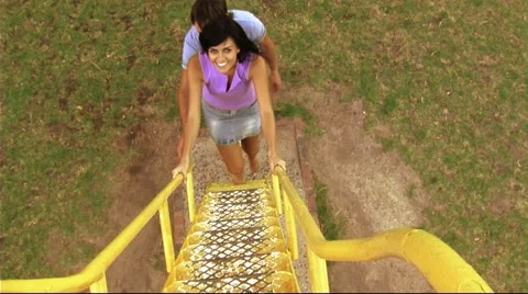 Young couple in park on slide Stock Footage 43683645