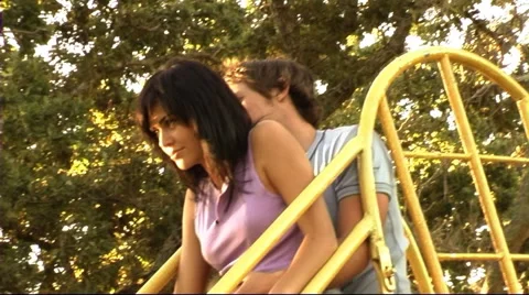 Young couple in park on slide Stock Footage 43683683
