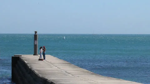 Young Couple on a Pier Stock Footage 24978205