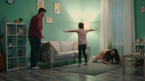 Young Couple Is Playing Game with Small Girl 스톡 동영상 147361849