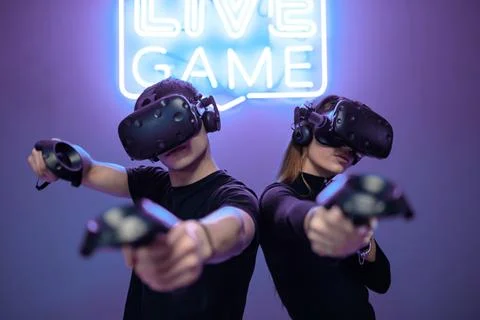 Young couple playing games. E-sports Stock Photos