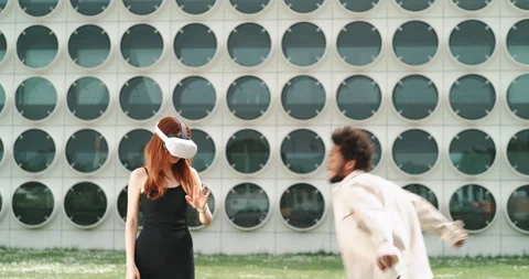 A young couple playing with virtual reality in the city center Stock Footage 201114477