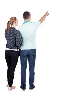 Young couple pointing at wal Back view Foto stock