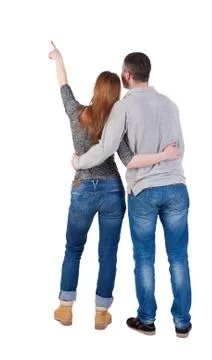 Young couple pointing at wal Back view  (woman and man Foto stock