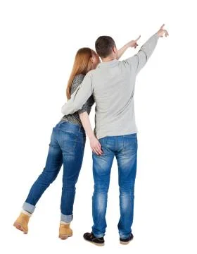 Young couple pointing at wal Back view  (woman and man Stock Photos