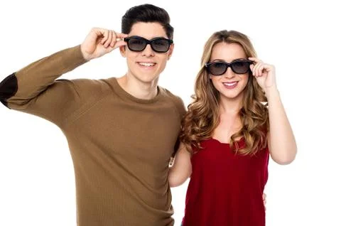 Young couple posing to camera with shades on Stock Photos