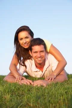 Young couple posing on a field Stock Photos