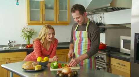 Young couple preparing food in kitchen Video stock 7729910
