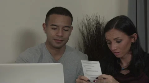 Young couple preparing home accounts Stock Footage 44112962