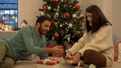 Young couple preparing presents for the Christmas holidays. Stock Footage 120636552