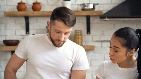 Young couple preparing salad dish together. Stock Footage 105121777