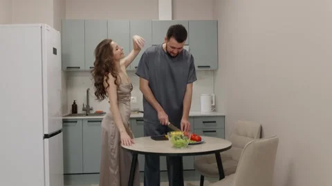 Young Couple Preparing Salad Together in Modern Kitchen Stock Footage 315568564