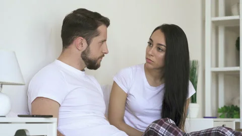 Young couple problems. Quarrel and talking at the bedroom. Stock Footage 107435421