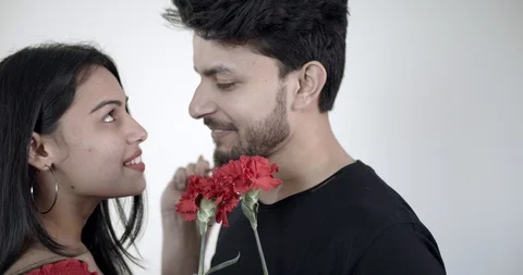 Young couple propose with a red flower Stock Footage 124479250