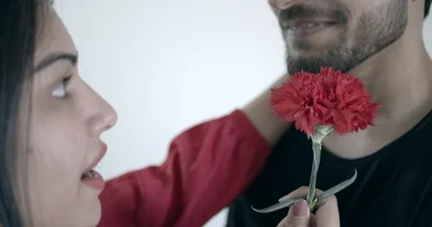 Young couple propose with a red flower Stock Footage 124479408