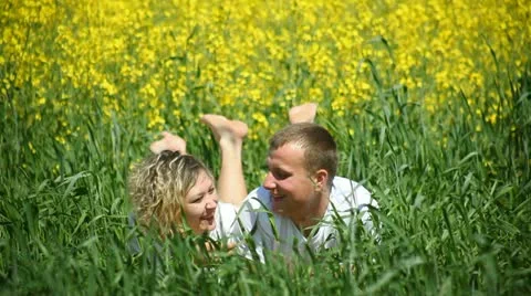 Young couple in rapeseed field Stock Footage 11098272