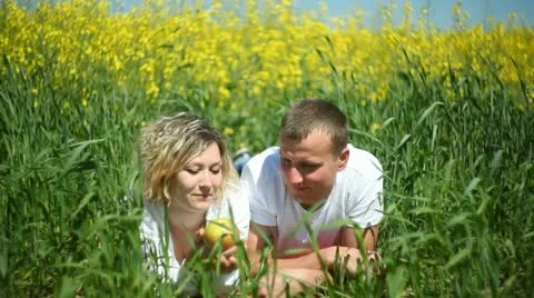 Young couple in rapeseed field Stock Footage 11113580