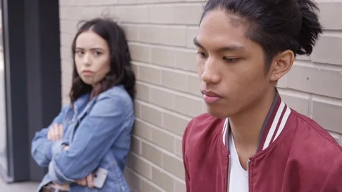 Young couple with relationship problems, boyfriend in focus - Slow Motion - shot Stock Footage 125217482