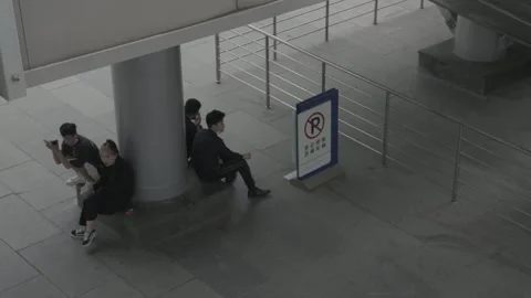Young Couple Rest Beside Column in Xidan Public Space Stock Footage 340465909