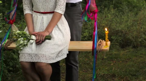Young couple riding on a swing Stock Footage 55158588