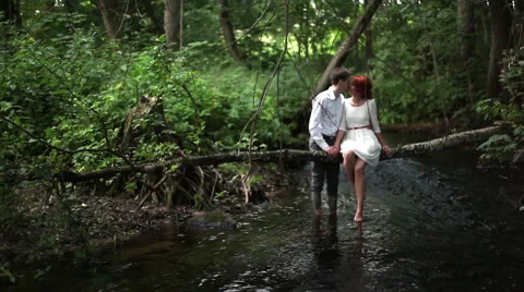 Young couple in a river Stock Footage 55159219