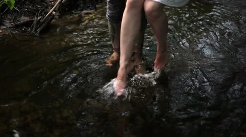 Young couple in a river Stock Footage 55159360