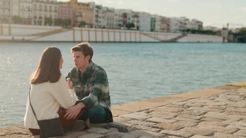 Young Couple by the River in Seville Stock Footage 314636710