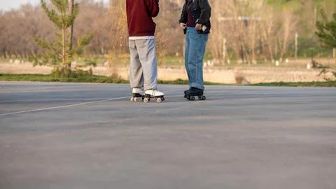 A young couple roller skating Stock Photos