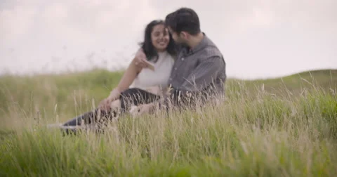 Young couple romancing in field Stock-Footage 59899924