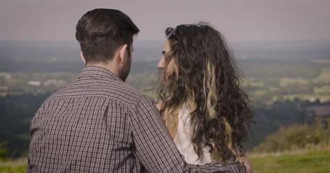 Young couple romancing in meadow Stock Footage 59899961
