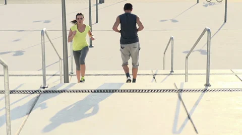 Young couple running up and down stairs HD Stock Footage 39412076