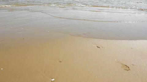 Young couple running and playing in surf Stock Footage 43619783
