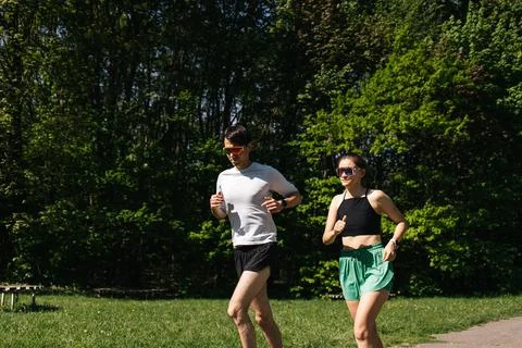 Young Couple Running in Park in Sofia Sunny Day Stock Photos