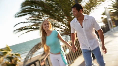 Young couple running towards camera Stock Footage 43615758