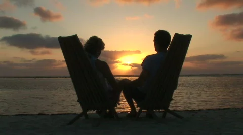 Young Couple seated on Beach without sorrong Stock Footage 65470